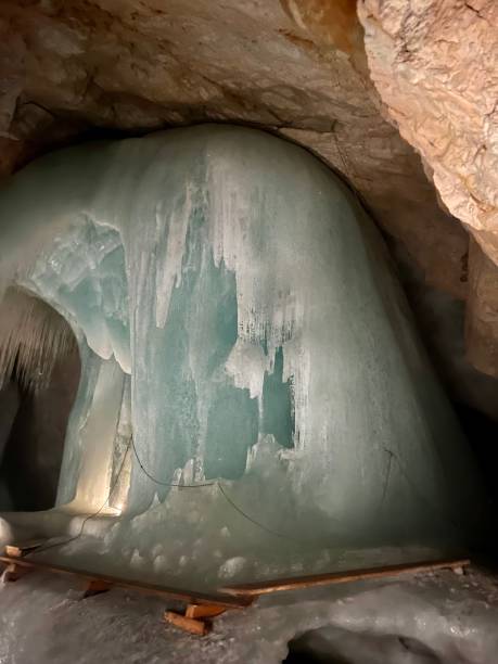 istock Ice cave. Ice in the cave. Illuminated cave. 1491572748