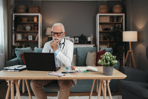 istock Senior doctor working in office 1491573114