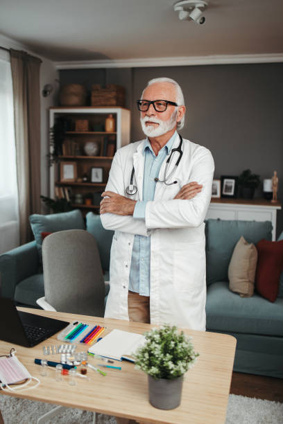 istock Senior doctor working in office 1491574010