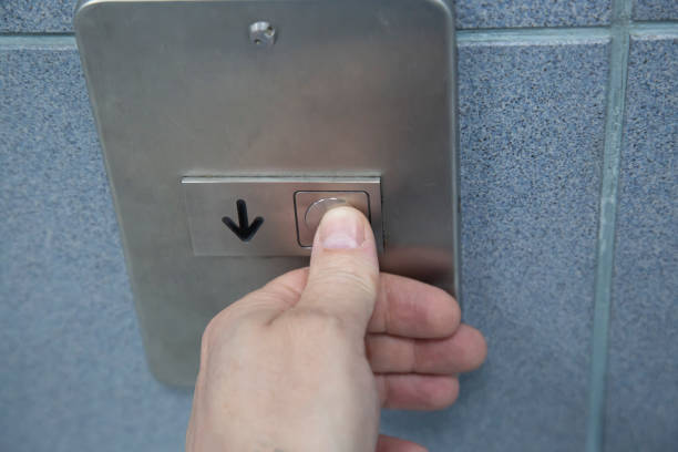 istock The person in the elevator presses the button to start moving. 1491574371