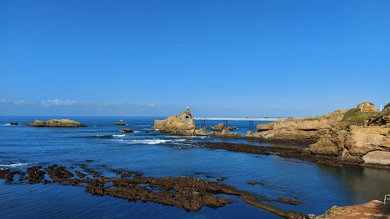 rocky coastline against a clear blue sky