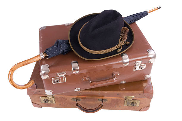 istock Two vintage suitcases with umbrella and hat 149157718