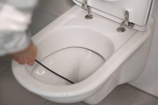 istock Man cleaning overflowing broken toilet. clogged toilet. 1491578614