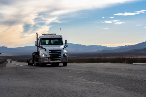 istock A white semi truck cruised through the Nevada Desert, its massive frame contrasting against the golden hues of the setting sun. Towering mountains framed the scene, creating a picturesque backdrop. 1491579059