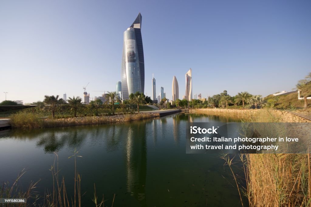 Modern skyscraper reflecting into the lake water in Kuwait City Architecture Stock Photo