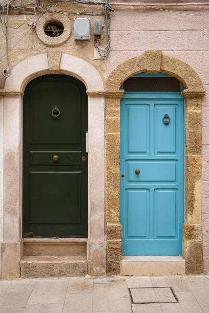 istock mediterranean style wooden doors with knockers 1491581170