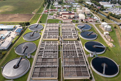 Sewage treatment plant in an industrial district, aerial view.