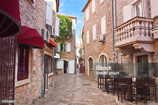 Narrow Street In Old District Of Budva Stock Photo - Download Image Now - Alley, Balcony, Brick