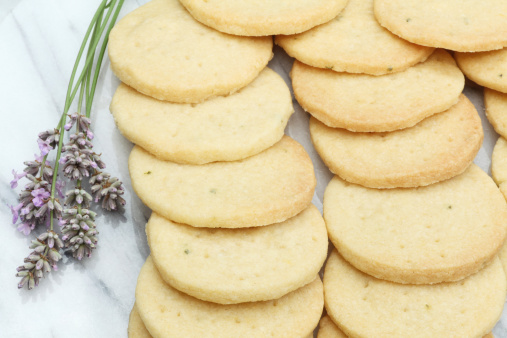 Lavender biscuits on a marble plate with lavender flowers