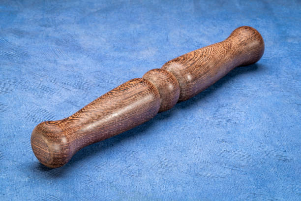 istock Wooden Tai Chi ruler, a  traditional Chinese exercise tool, rests on textured paper, symbolizing tranquility and balance. Perfect for wellness and mindfulness themes. 1491593869