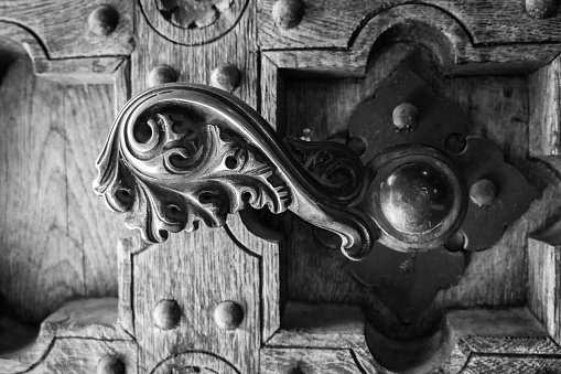 Close up of a old door handle in black and white