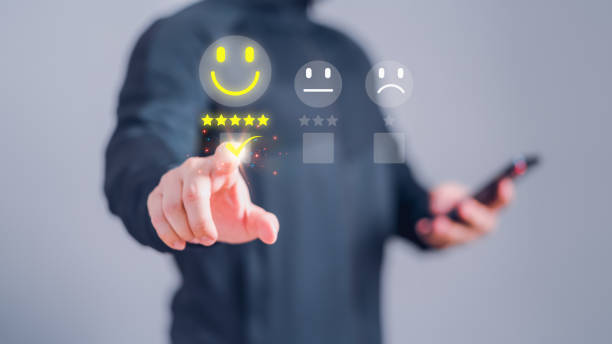 istock Man touching the virtual screen on the happy smiley face icon and five star to assessment satisfaction in service. Rating very impressed. Customer service, testimonial and satisfaction concept. 1491604474