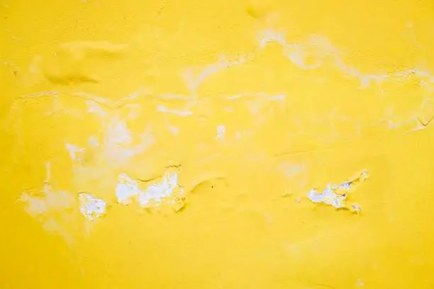 Photo of Yellow cement wall texture and background.  cracked yellow abstract background