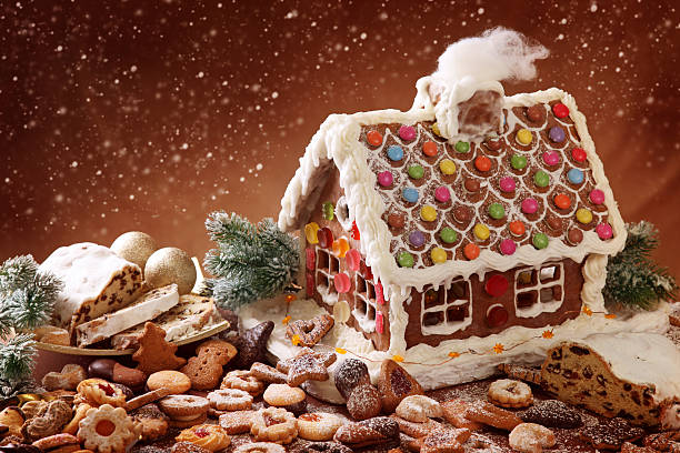 istock Gingerbread house with delicious candy surrounded by cookies 149160824