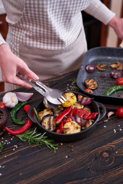 istock Grilled vegetables in black ceramic plate on table at domestic kitchen 1491608622
