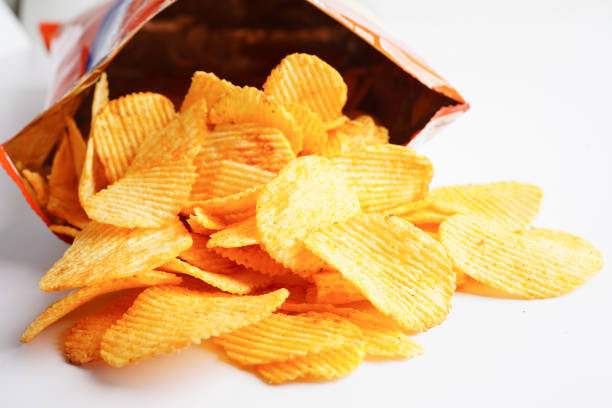 istock Potato chips in open bag, delicious BBQ seasoning spicy for crips, thin slice deep fried snack fast food. 1491612400