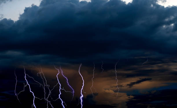 istock Panorama Dark cloud at evening sky with thunder bolt. Heavy storm bringing thunder, lightnings and rain in summer. 1491618497