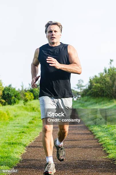 Determined Looking Sportsman Stock Photo - Download Image Now - Jogging, Men, Running