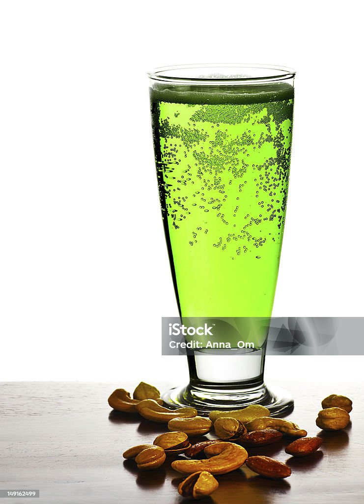 Irish green beer Irish green beer, traditional alcohol for st.Patrick's day holiday celebration, lucky clover beverage, glass with nuts, food and drink still life, isolated on white background Alcohol - Drink Stock Photo