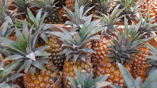 Pineapple in a wooden box. Sweet and fresh