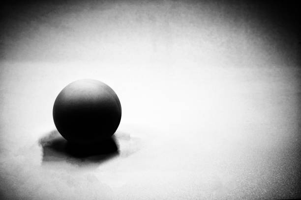 istock A black and white  graphic image showing a black spherical ball beautifully reflecting light. 1491633451