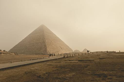The Cheops pyramid in Gizeh on a foggy morning