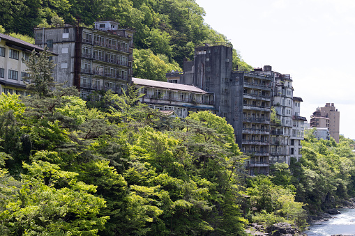 abandoned hot spring hotel and resort area during Japanese asset price bubble near Kinugawa river and Kinugawa town