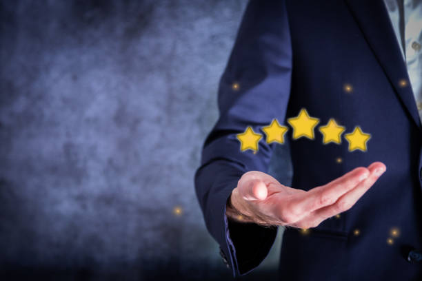Hand shows sign of top service Quality assurance 5 star, Guarantee, Standards, good service, premium, five stars, excellence service, high quality, business excellence. Quality Assurance Concept stock photo