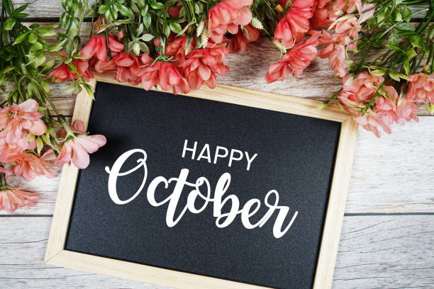 istock Happy October text on blackboard with flower bouquet decoration 1491640287