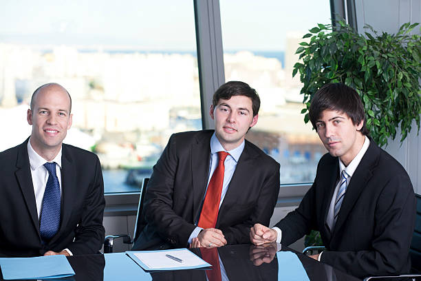 istock Business partners smiling in office 149164272