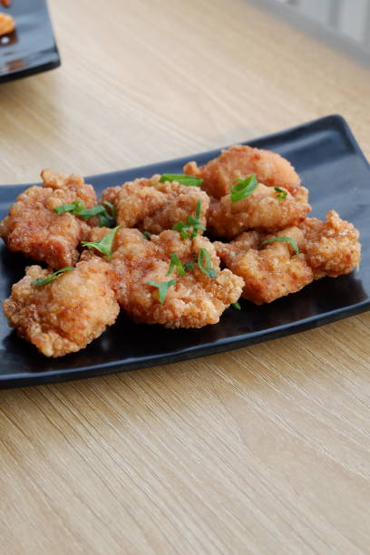 istock Crispy fried chicken with a sprinkling of chopped green onions 1491643516