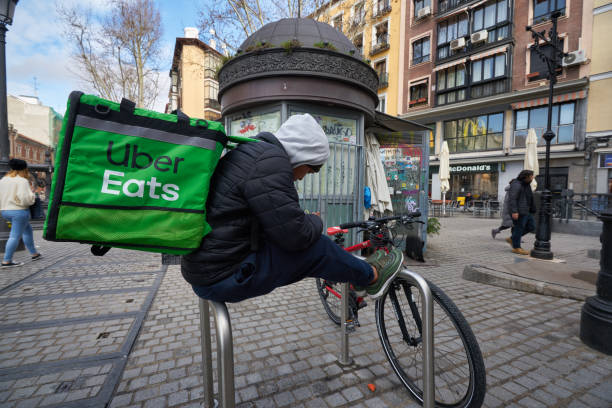 Uber Eats rider seen in Madrid stock photo