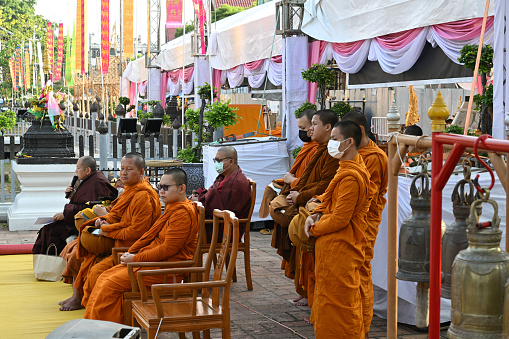 Chiangmai, Thailand - May 20, 2023:The monks preach to the people.\n\nCeremony of wearing flower bowls to worship Inthakhin pillars (Chiang Mai City Pillar) for the year 2023, a merit-making event that has been inherited for a long time. Chiang Mai people will worship Inthakhin at the end of the 8th month, the 9th month, or between May and June.\n\nThis year, held on May 16-22, 2023 and May 23, 2023, is a merit-making day at Wat Chedi Luang Worawihan. Mueang Chiang Mai District Chiang Mai Province