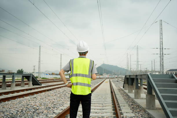 The security officer is carrying out a safety check on the railway