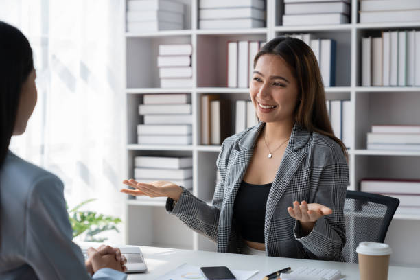 istock Two Asian businesswoman discussing new startup projects, presenting ideas, analyzing planning and financial statistics and investment markets with data graph documents at office. 1491655797
