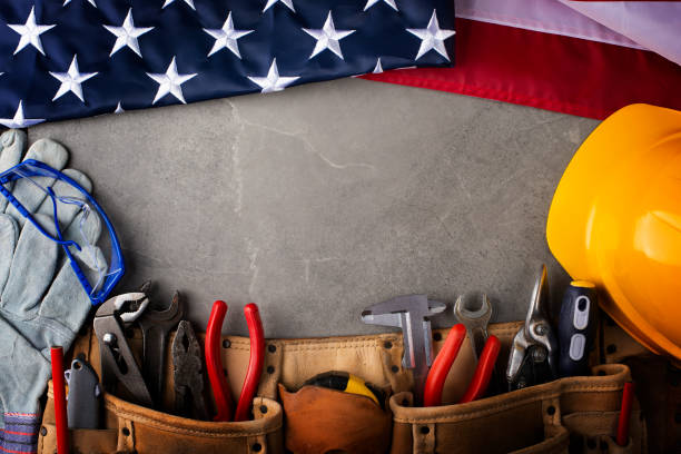istock Tools hardhat toolbelt and us flag on concrete cement background labor day banner mockup 1491656923