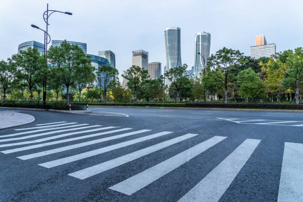 istock empty road with zebra crossing and skyscrapers in modern city 1491659792