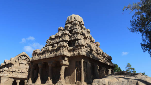 istock This group of monuments is generally called as five rathas as they resemble the processional chariots of a temple. Statues carved in rock. this is one features in several Hindu scriptures. blue sky backgrounds 1491668083