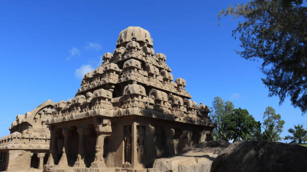 istock This group of monuments is generally called as five rathas as they resemble the processional chariots of a temple. Statues carved in rock. this is one features in several Hindu scriptures. blue sky backgrounds. one side view 1491668089