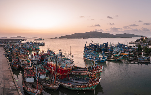 Songkhla,Thailand- 8 March 2023: Spectacular fishing boats in the harbor of Songkhla at twilight.