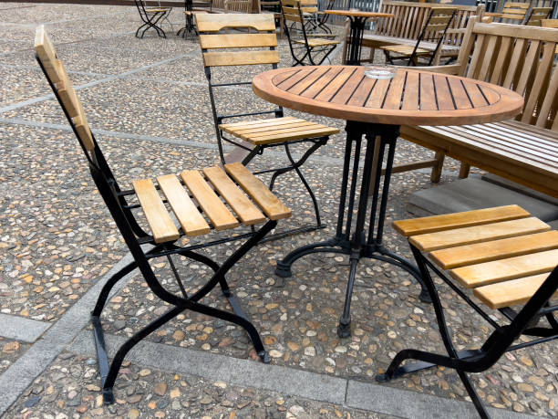 istock wooden chairs and tables in openair cafe 1491670166