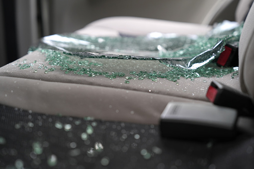 Cracked and crazed glass reveals the handiwork of a thief during the night, discovered the following morning. It is yet another car crime in Penang, Malaysia.