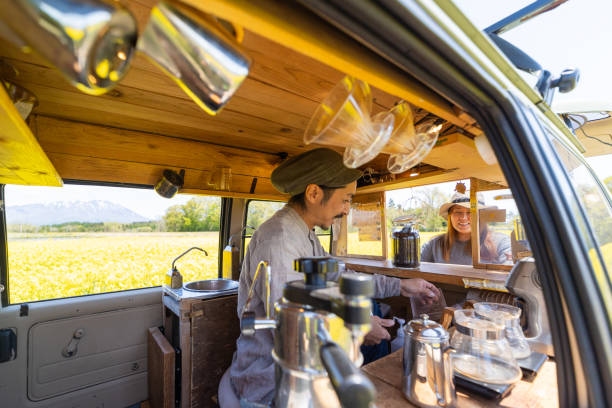 istock An Asian man making coffee in his mobile coffee van parked outdoors 1491675101