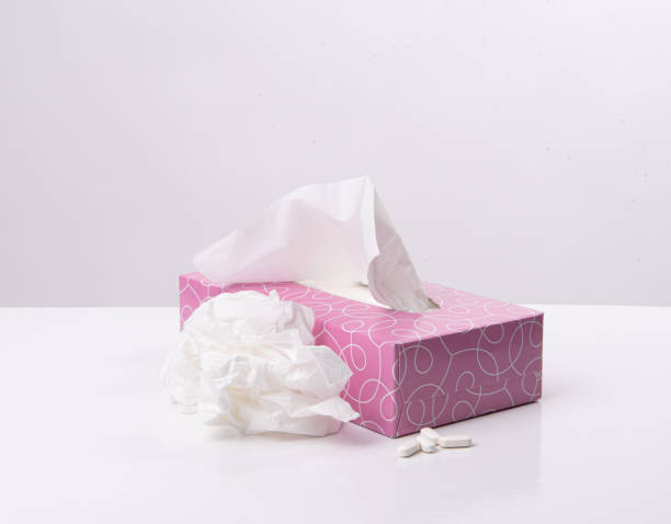 istock Box of tissues and pills on a white background 1491676001