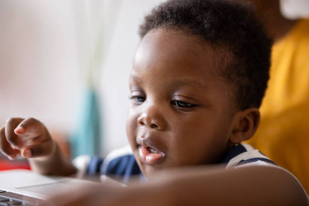 istock African American toddler boy typing on laptop keyboard 1491677703