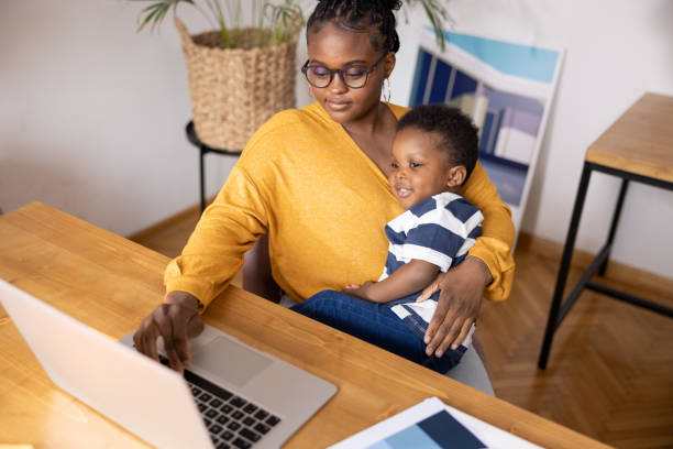istock African American mother hugging her son while working from her home office 1491677742