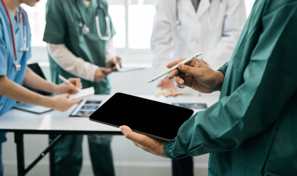 istock Medical team working on digital tablet healthcare doctor technology tablet using computer analyzed the results of medical reports at the hospital. 1491677797