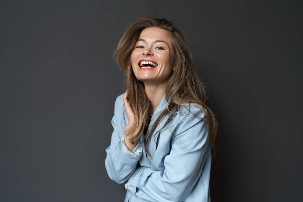 istock Happy young businesswoman posing over black background 1491679000
