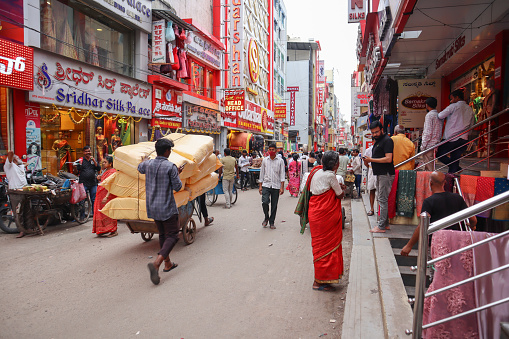 Bangalore, Karnataka, India-September 27 2022; A Street picture of the famous Bazaar known as Chickpet during the business hour at Bangalore city in Karnataka, India.