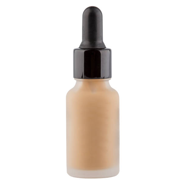 istock Foundation cosmetic glass jar with tinted moisturizer isolated on white 1491682058
